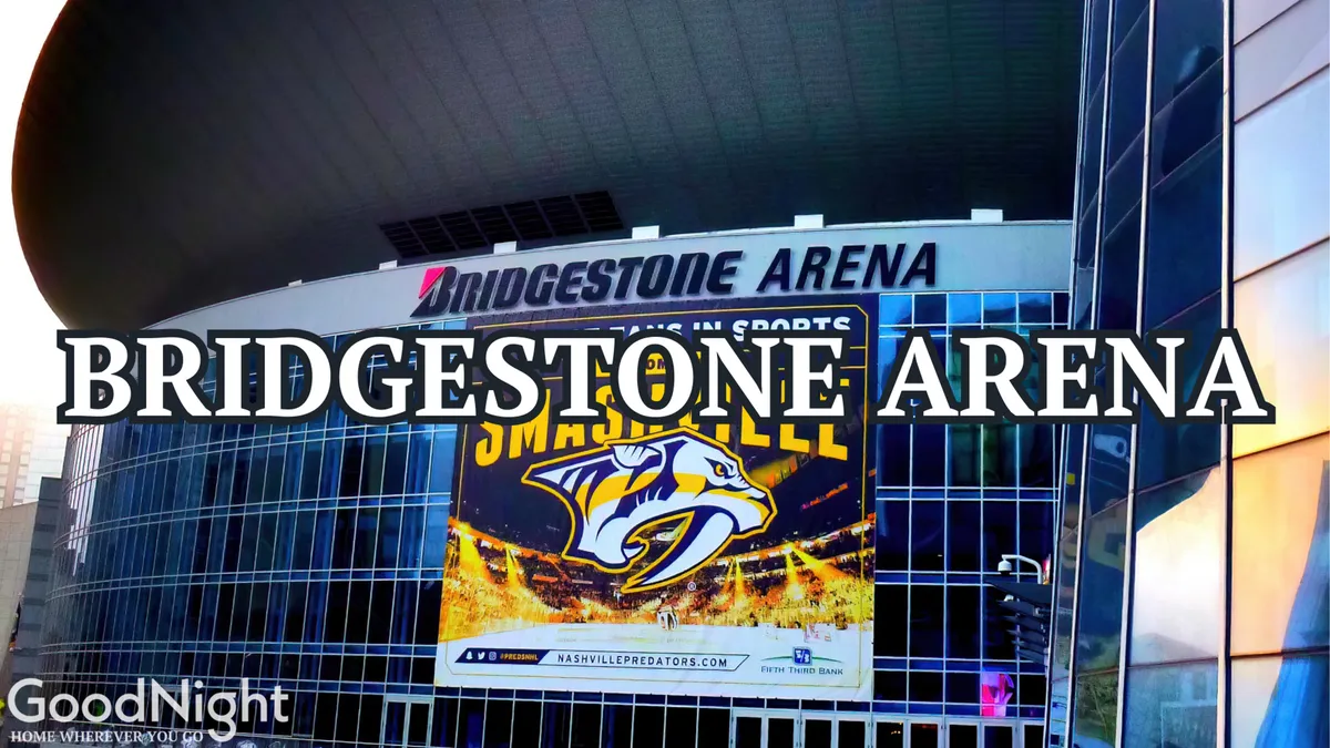 An exterior shot of Bridgestone Arena with its prominent signage and a Nashville Predators banner. The modern glass façade and lively street scene set an energetic tone, suggesting a hub for concerts, sporting events, and major cultural gatherings in downtown Nashville.