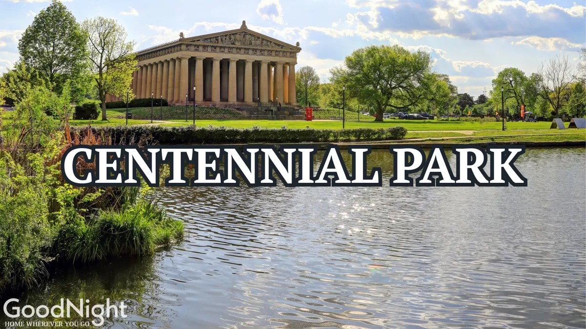 A serene view of Nashville's Centennial Park, featuring lush greenery, a calm lake reflecting the sky, and the iconic Parthenon-like structure in the background. The scene captures people walking and enjoying the outdoors, with spaces perfect for picnicking or a relaxing stroll.